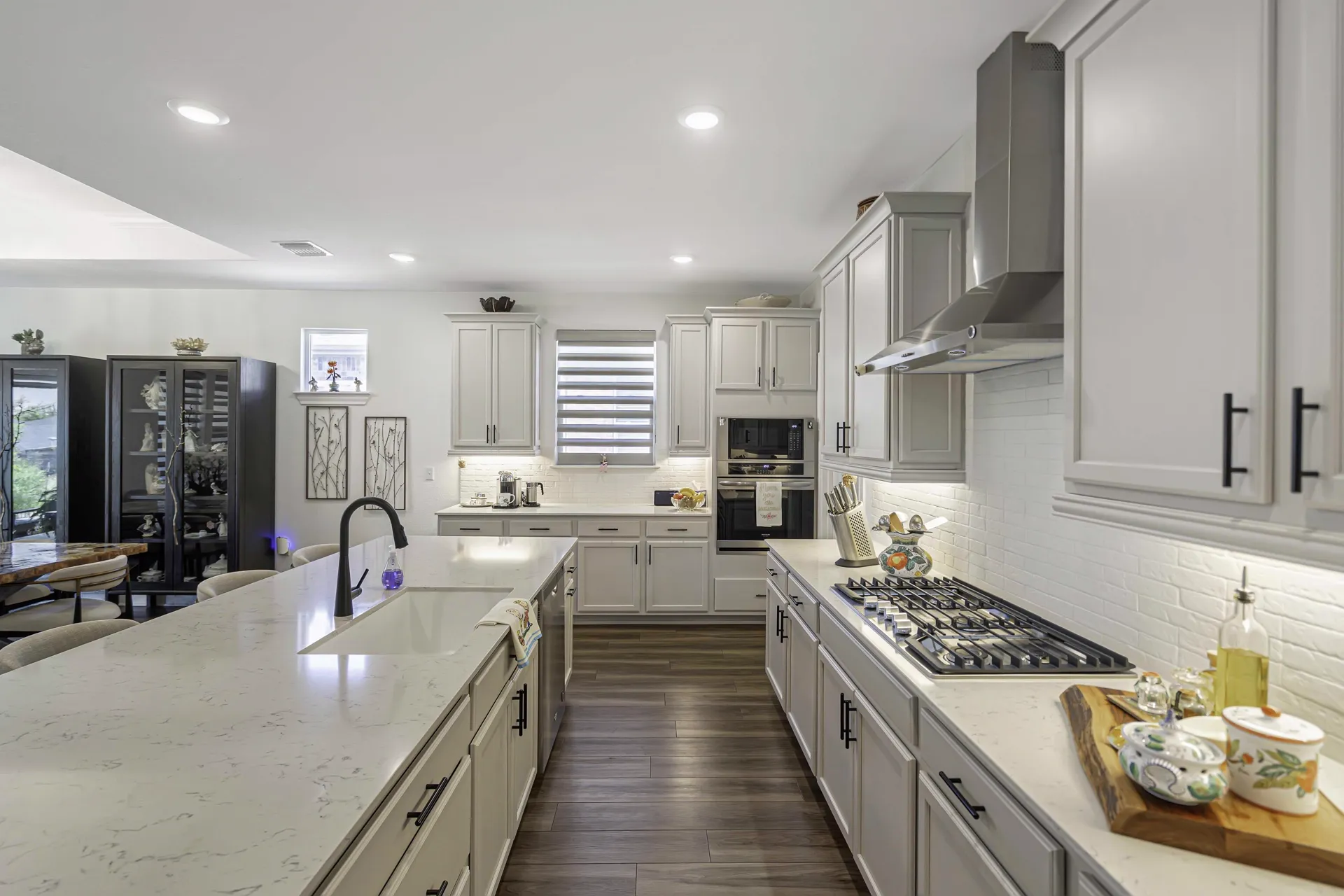 Kitchen countertops with dark appliances and ample workspace
