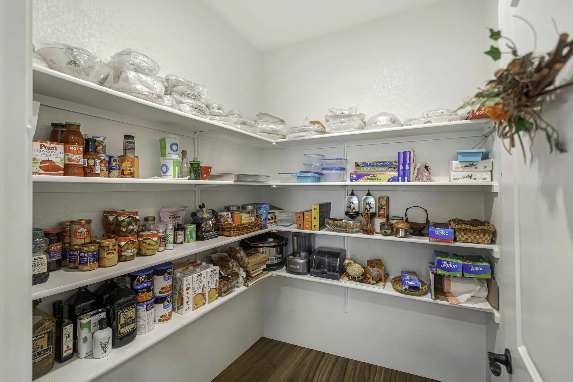 Walk-in pantry with organized shelving and storage