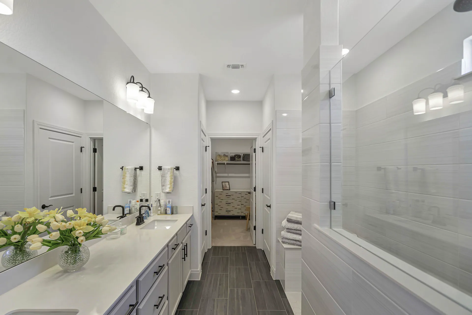 Primary bathroom — wide view with dual sinks and ample counter space